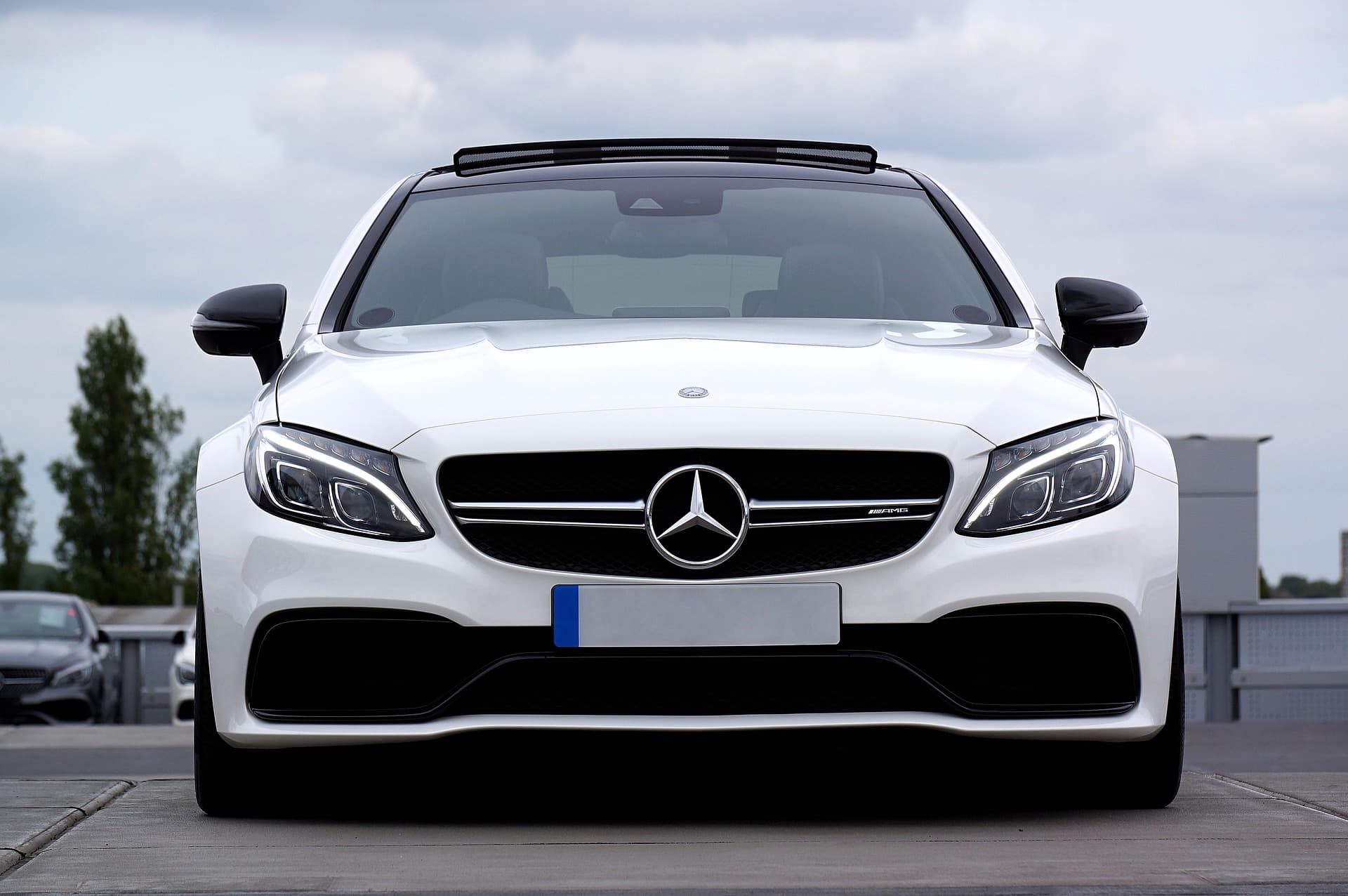 White Mercedes C63 with clean glass profile